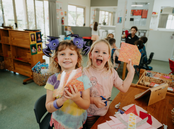 energetic kids laughing and playing games in a colorful play area